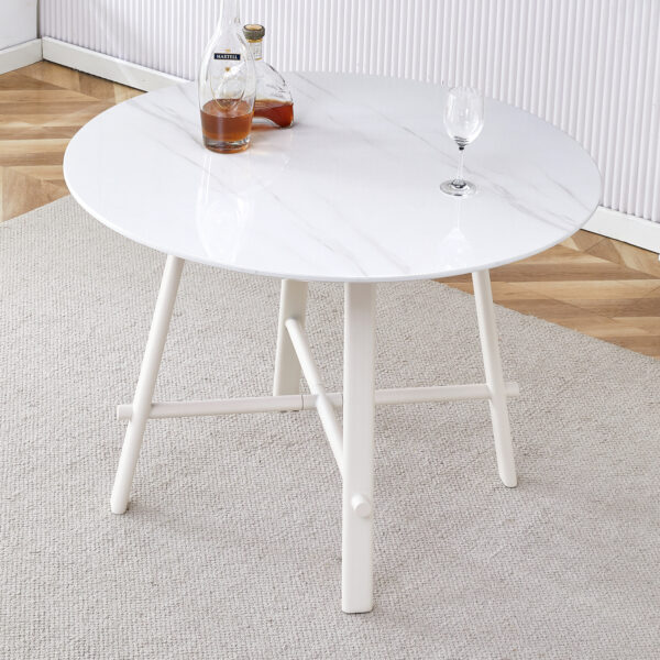 5bd33f23f80c4f07b7e25729dab66767_a6483e3415371faeeef5ab445e6a235b A modern minimalist circular dining table with a 42 inch diameter white patterned tabletop and white metal legs. Suitable for restaurants, living rooms, and conference rooms.