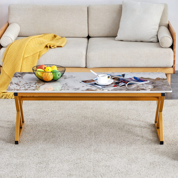 5be1e45d1b9b455083433b2e424b4f75_b35fd0142b89b4b699be7f28d3f9e39d A coffee table is made of rock slab material, with a natural and smooth marble pattern on the surface, which complements the modern design of the golden metal legs and adds a touch of fashion.47*23.6