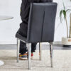 4 piece set of black armless dining chairs brings a touch of elegance and mystery to the dining area with its deep black tone,The grid and buckle design of the back add a vintage yet fashionable touch
