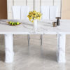 Table and chair set.64.5x35.4 Inch Stylish White Marble Textured Dining Table.Paried With 4 White PU Chairs with a vertical stripe design on the backrest.Create Your Exclusive Low-Key Luxury Space.