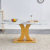 A modern minimalist dining table. Imitation marbled glass tabletop. Gold MDF table legs for kitchen and living room