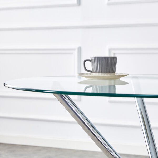 6946803b89bd4d669662926c2755fc13_46be10860ca26514f97cf0769046f7f9 Table and chair set.36.6"Round clear glass dining table with a unique shape with ring-shaped gathered silver metal legs.Paired with 4 Dark gray high-quality PU dining chairs with silver metal legs.
