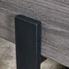 A rustic gray wood grain MDF coffee table with black metal legs - an elegant space in natural wood tones