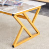 A coffee table is made of rock slab material, with a natural and smooth marble pattern on the surface, which complements the modern design of the golden metal legs and adds a touch of fashion.47*23.6