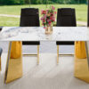 Table and chair set.63"x31.5x30" Luxurious Pandora patterned Sintered Stone Tabletop with Golden Stainless Steel Butterfly Legs.Paried With 4 Black High-quality PU Chairs With Arched Metal Legs.
