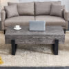 A rustic gray wood grain MDF coffee table with black metal legs - an elegant space in natural wood tones