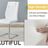 Table and chair set.63"x31.5x30" Luxurious Pandora patterned Sintered Stone Tabletop with Silver Stainless Steel Butterfly Legs.Paried With 6 White High-quality PU Chairs With Arched Metal Legs.