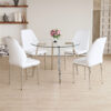Table and chair set.Modern circular transparent tempered glass table, tempered glass tabletop, silver metal table legs.A Set of 4 White PU Comfort Dining Chairs with extended backrest.