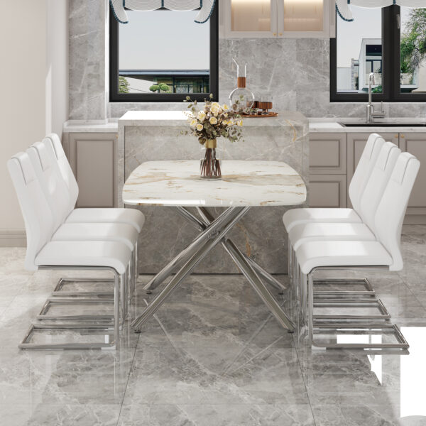8295a669207d46ceb4591970852aa804_0da917c52e548aa9bc2fc359dd2115a5 Table and chair set.Modern Luxurious white Marble-Patterned Tempered Glass Dining Table with 6 Chairs.Single fork silver metal table legs.White high-quality PU dining chairs with silver metal legs.