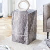 Elevate your living space with this modern MDF coffee table, which showcases gray textured patterns. It is characterized by stylish design.