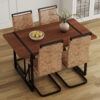 Table and chair set. A minimalist retro rectangular dining table with a specially textured top and black metal legs, paired with 4 soft chairs and black metal legs, showcases a beautiful home style.