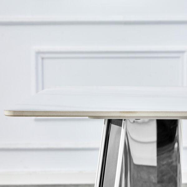 83d3e00b46454da794f957275fb466e7_3509d4bf6b6e867f7cbcd828eca15877 Table and chair set.63"x31.5x30" Luxurious Snow Mountain Patterned Sintered Stone Table with Silver Metal Butterfly Legs.Paried With 4 Dark Gray High-quality PU Chairs With Arched Metal Legs.
