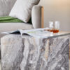 Elevate your living space with this modern MDF coffee table, which showcases gray textured patterns. It is characterized by stylish design.