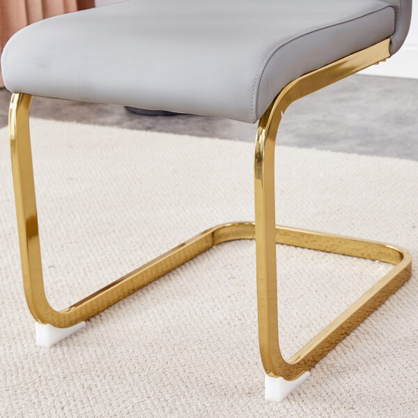 Table and chair set.71"x35.4"x30" Luxurious Pandora Patterned Glass Dining Tabletop with Golden Back To Back C-Shaped MDF Legs.Paried With 8 Light Gray PU Chairs with golden C-tube metal leg.