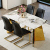 Table and chair set.63"x31.5x30" Luxurious Pandora patterned Sintered Stone Tabletop with Golden Stainless Steel Butterfly Legs.Paried With 4 Black High-quality PU Chairs With Arched Metal Legs.