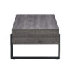 A rustic gray wood grain MDF coffee table with black metal legs - an elegant space in natural wood tones