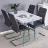 Table and chair set.White MDF Coffee Table - Reinforced with Tempered Glass Legs.Paired with 4 Dark Gray high-quality PU chairs with silver metal legs.