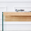 The top of the coffee table is made of medium density fiberboard and wooden stickers, with transparent tempered glass on both sides. The design is simple and elegant, with a sturdy structure.
