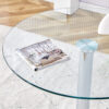 A 35-inch diameter glass top and a modern, minimalist round dining table with silver metal legs. Ideal for dining rooms, living rooms and meeting rooms.