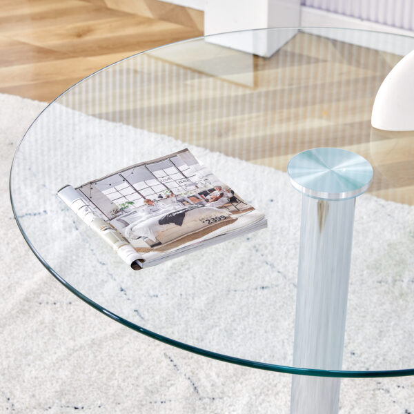 951bdf4e15c747a9939a970cd7d08e0a_20240320_a5547b5a3cea4cb4d0583fb3c1297179 A 35-inch diameter glass top and a modern, minimalist round dining table with silver metal legs. Ideal for dining rooms, living rooms and meeting rooms.