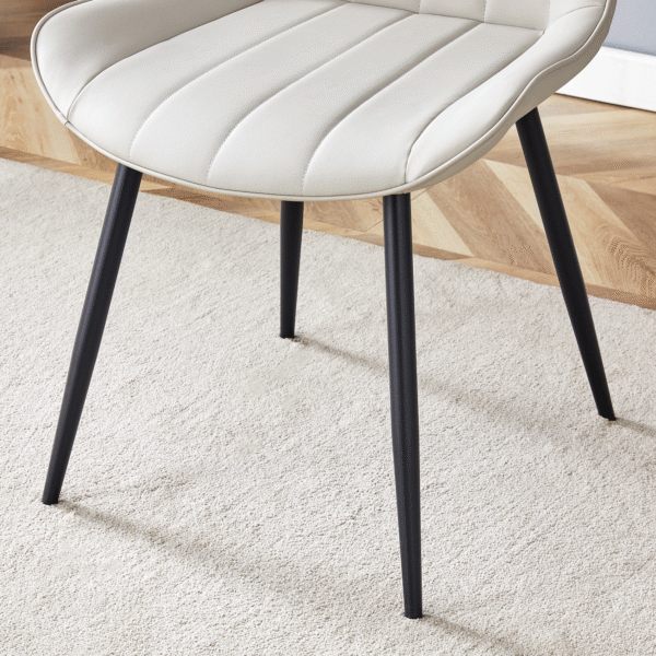 9a8a9bbd59b24add80c539ec4e65c94f_1c9e4809f06554fdea8adbc17c5d0ef2 Extended Seat Cushion PU Dining Chair Set - Four Pieces,Ergonomic Design.Smooth line design,Integral metal leg structure,Can integrate well into various modern home decoration styles.