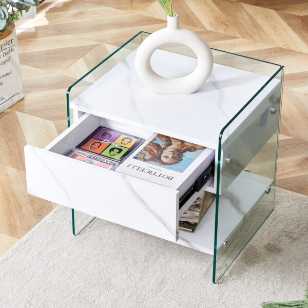 9e049ad4b1074b2790baf95080583ba1_d43663fff48b86ec74afdbb1d5efbbcb Bedside table with drawers. The board surface is MDF sticker, and both sides are transparent tempered glass. The design is simple and elegant, with excellent storage functions.