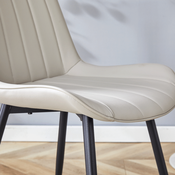 a1697a1d510f40c4b5b7fd6bc0df3841_22bab83d2da6069c9e5b63243922db9e Extended Seat Cushion PU Dining Chair Set - Four Pieces,Ergonomic Design.Smooth line design,Integral metal leg structure,Can integrate well into various modern home decoration styles.