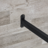 A minimalist retro rectangular dining table with a specially textured top and black metal legs.Contemporary Minimalist MDF Gray Textured Tabletop.Able To Give People A Visual Beauty With Rules.
