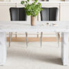 Table and chair set.63"*35.4" White Imitation Marble Pattern MDF Dining Table Set - 4 Black PU Chairs with a vertical stripe design on the backrest.Create Your Exclusive Low-Key Luxury Space.