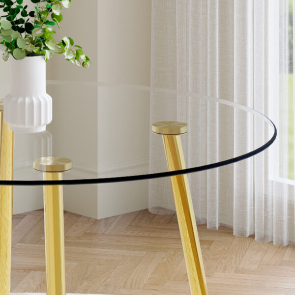 a809bc6675694860a5cc58895a420e13_c4529e1255f7fb53e83aa9df9bfe094d A modern minimalist style round transparent tempered glass table with gold metal legs, paired with 4 modern PU leather high-back dining chairs, bring a luxurious experience.