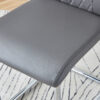 Table and chair set.White MDF Coffee Table - Reinforced with Tempered Glass Legs.Paired with 4 Dark Gray high-quality PU chairs with silver metal legs.