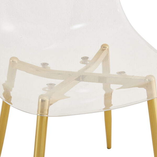 aaa2dde6f43645a9a7c7911a697fc2a0_6ba995ed1a64de85a5d12e6460720a38 Transparent and stylish ergonomic dining chair unlocks a new experience of lightweight fashion, comfort, and stability. Transparent seat cushion, golden metal legs. One box of three.