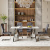 Table and chair set.63"x31.5x30" Luxurious Snow Mountain Patterned Sintered Stone Table with Silver Metal Butterfly Legs.Paried With 4 Dark Gray High-quality PU Chairs With Arched Metal Legs.