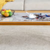 A coffee table is made of rock slab material, with a natural and smooth marble pattern on the surface, which complements the modern design of the golden metal legs and adds a touch of fashion.47*23.6