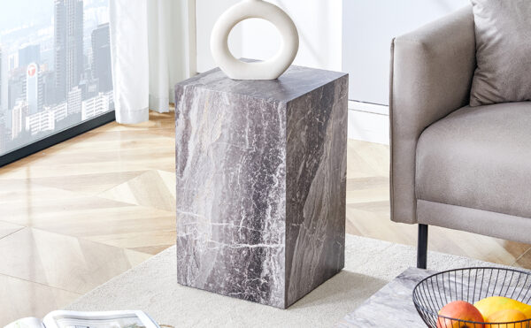 Elevate your living space with this modern MDF coffee table, which showcases gray textured patterns. It is characterized by stylish design.