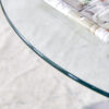 A 35-inch diameter glass top and a modern, minimalist round dining table with silver metal legs. Ideal for dining rooms, living rooms and meeting rooms.