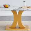 A modern minimalist dining table. Imitation marbled glass tabletop. Gold MDF table legs for kitchen and living room