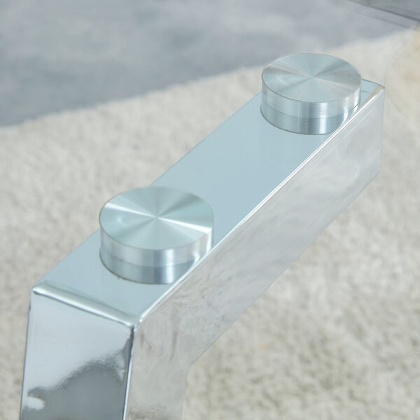 b09091ead93d412692158490d8b9167f_8e535731faad7aeb5b19480decdb8fa8 71 * 35.4 inch rectangular dining table. The transparent tempered glass tabletop is paired with silver 7-shaped metal table legs, showcasing a minimalist texture. Suitable for various places.