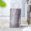 Elevate your living space with this modern MDF coffee table, which showcases gray textured patterns. It is characterized by stylish design.