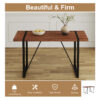 Table and chair set. A minimalist retro rectangular dining table with a specially textured top and black metal legs, paired with 4 soft chairs and black metal legs, showcases a beautiful home style.