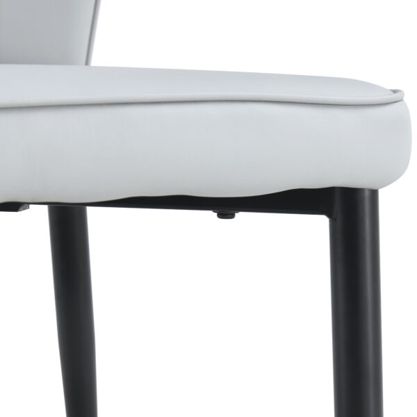 b7627aaff73448668c0fa9224de43729_892304035e43bc9db0972dae476e8ae8 4 light gray modern dining chairs with stylish PU patterned backrest and black metal legs for a comfortable home experience in the kitchen, bedroom and office.
