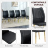 Four black dining chairs. A medieval modern chair made of PU material with soft cushions, equipped with golden metal legs. Suitable for restaurants and living rooms