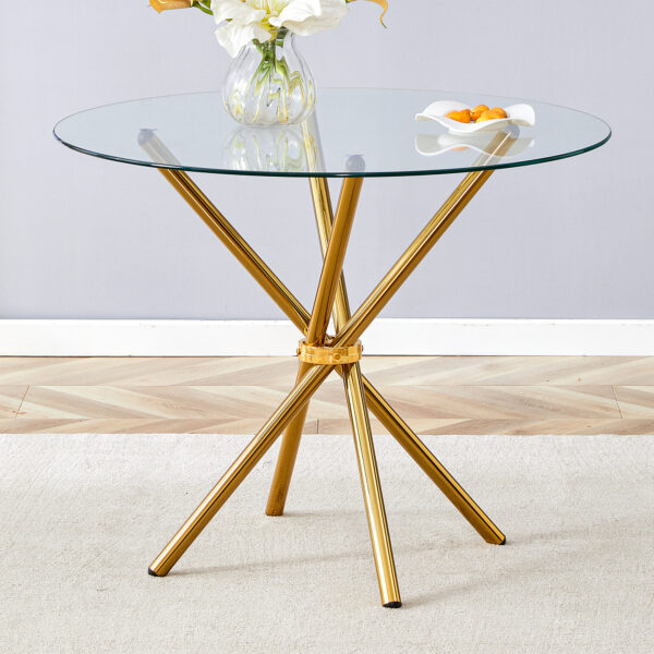 be07ec17940a41d390abcfdd2c0a1bdf_2affa492a84bbcfde52a6f9efeba8677 Round clear glass dining table with a unique shape for 4-6 people, with ring-shaped gathered gold metal legs, suitable for desks, kitchens, terraces, dining rooms.