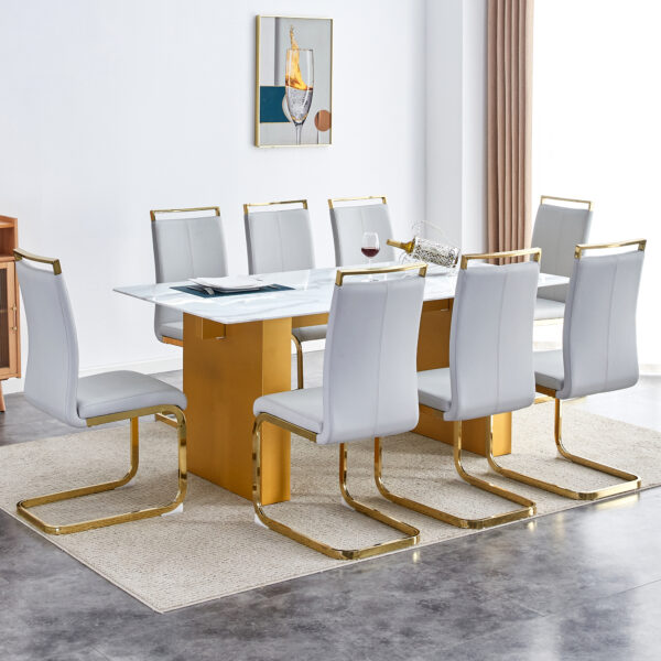 bf36fcb754604e32b5e046e370667814_5412d193d387bdb98bd061ec9421569b Table and chair set.Large modern rectangular table with 0.4 inch patterned glass tabletop and large MDF table legs.Comes with 8 chairs with faux leather cushioned seats and golden metal legs.