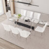 Table and chair set.Elegant Transparent Tempered Glass Dining Set - 71"x35.4" with 8 White PU Chairs with a vertical stripe design on the backrest.