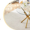 Round clear glass dining table with a unique shape for 4-6 people, with ring-shaped gathered gold metal legs, suitable for desks, kitchens, terraces, dining rooms.