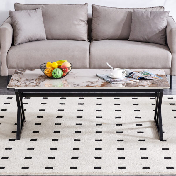 c3d73393e6e849108d2196b2b2e3d256_ad915c516067692e58a9058e72f79f49 A coffee table is made of rock slab material, with a natural and smooth marble pattern on the surface, which complements the modern design of the black metal legs and adds a touch of fashion.47*23.6