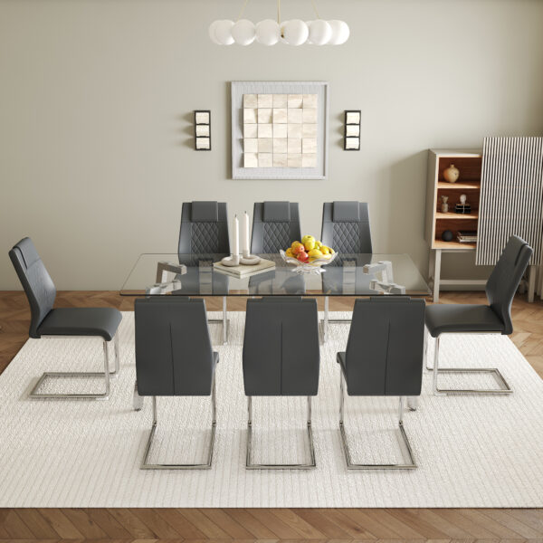 c3f08a834762480c8db8e9499bca6089_db5b248eb936eb503c1207e4475ac250 Table and chair set.71 * 35.4 inch rectangular dining table.Tempered Glass Tabletop,Silver 7-shaped Metal Table Legs.Paried With 8 Dark Gray High-quality PU Chairs With Arched Metal Legs.