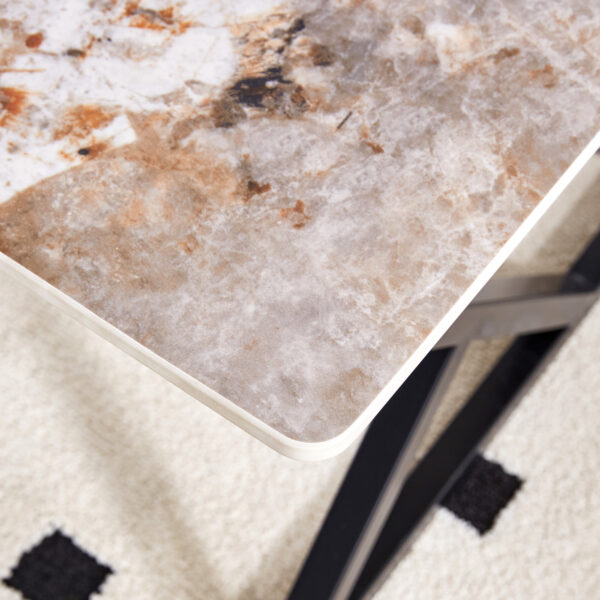 c63d70a9be544055ae6b848fec991191_2d9ea45615a301485f08f03d6a8968cd A coffee table is made of rock slab material, with a natural and smooth marble pattern on the surface, which complements the modern design of the black metal legs and adds a touch of fashion.47*23.6