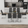 Table and chair set.Modern Luxurious Transparent Tempered Glass Dining Table Set with 8 Chairs.Single fork silver metal table legs.Dark gray high-quality PU dining chairs with silver metal legs.